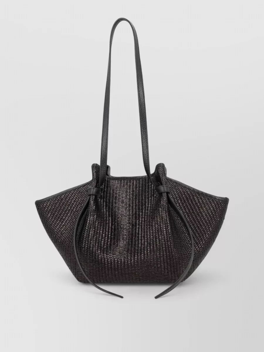 Yuzefi mochi shoulder bag — Yuzefi’s black woven tote brings structured texture in the same inky palette, matching the refined tier and adding just enough interest against the clean, fluid silhouette.