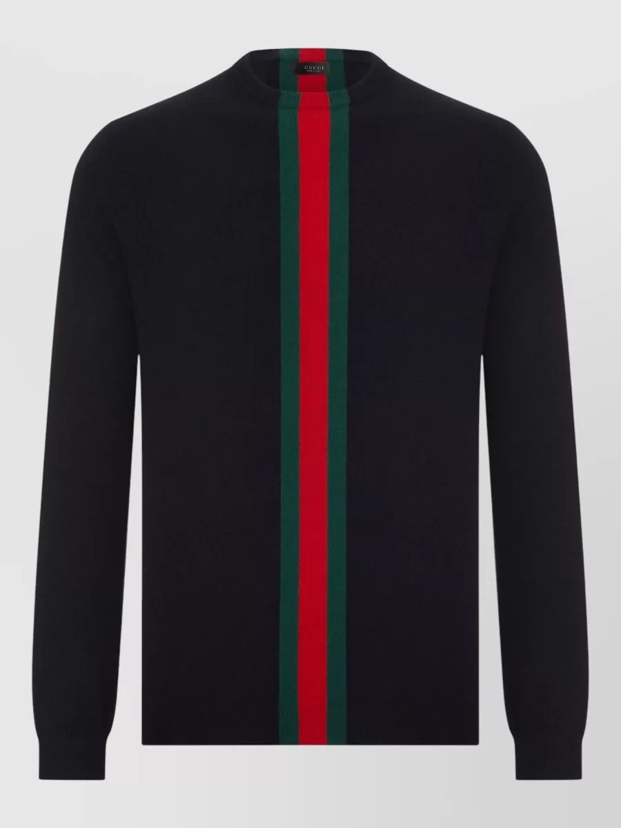 Gucci Cashmere crewneck sweater — The long-sleeve crew in black with a central green-red-green stripe mirrors the jacket’s stripe perfectly, keeping the palette tight and the silhouette clean under a structured bomber.
