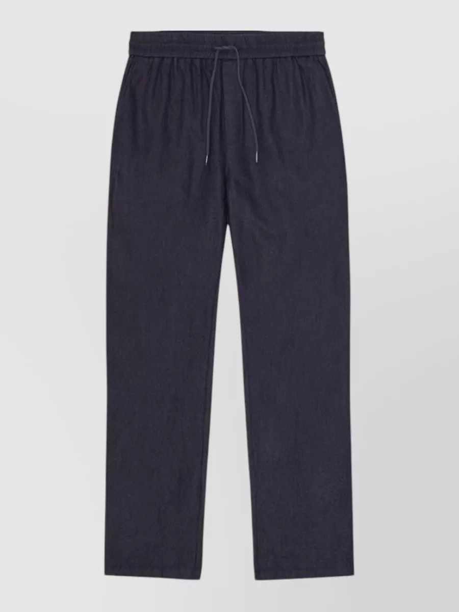 Les Deux Linen cotton straight leg trousers — The ink navy straight leg jogger keeps the line relaxed-sporty while tonally matching the jacket, giving a cohesive track inspired set that still feels considered for the city.