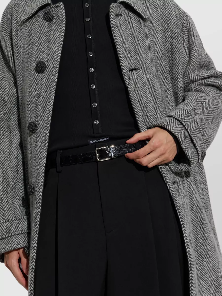 Dolce&Gabbana Caiman leather belt — The slim black crocodile-effect belt adds a discreet texture echoing the loafer detail and blazer check, sharpening the waist without distracting from the tailored silhouette.