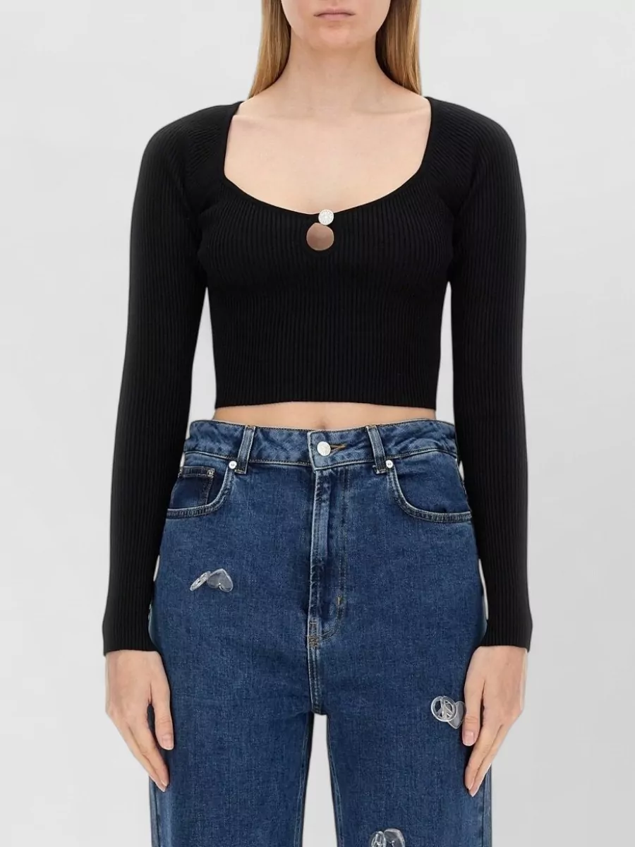 Moschino Ribbed cropped knitted top — The cropped square-neck knit mirrors the skirt’s bodycon line and keeps the waist clean, giving a sharp, night-out Y2K energy without competing with the bold zebra pattern.