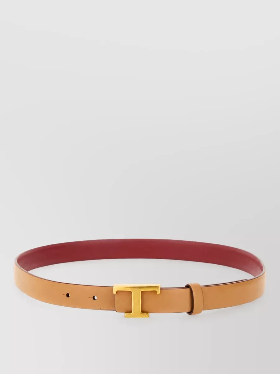 Tod's Leather reversible belt — The Tod’s slim belt with tan and berry tones subtly defines the high waist and bridges the vivid red knit with the deep burgundy skirt for a cohesive, intentional finish.