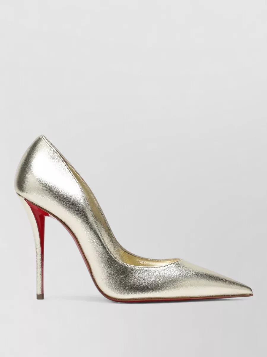 Christian Louboutin Laminated nappa leather pumps — The metallic gold Louboutin pumps mirror the necklace’s yellow-gold hardware and crystal sparkle, keeping the mood cocktail-ready while lengthening the leg against the soft white dress.