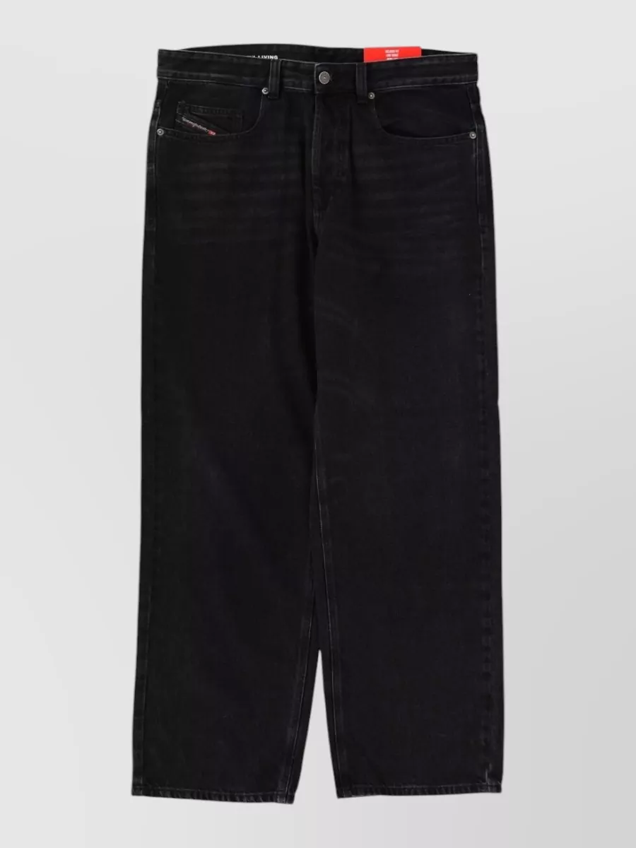 Diesel Relaxed-fit wide-leg jeans — The washed-black straight jeans mirror the jacket’s charcoal tone, keep the silhouette regular and grounded, and maintain the same casual streetwear formality as the bomber and hoodie.