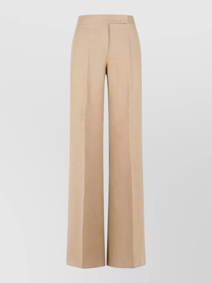 Max Mara Linen regular-fit wide-leg trousers — The camel-beige high-rise wide-leg trouser creates the long, fluid line the fitted black camisole wants, keeps the mood minimalist and formal, and lightens the palette for warm-weather city evenings.