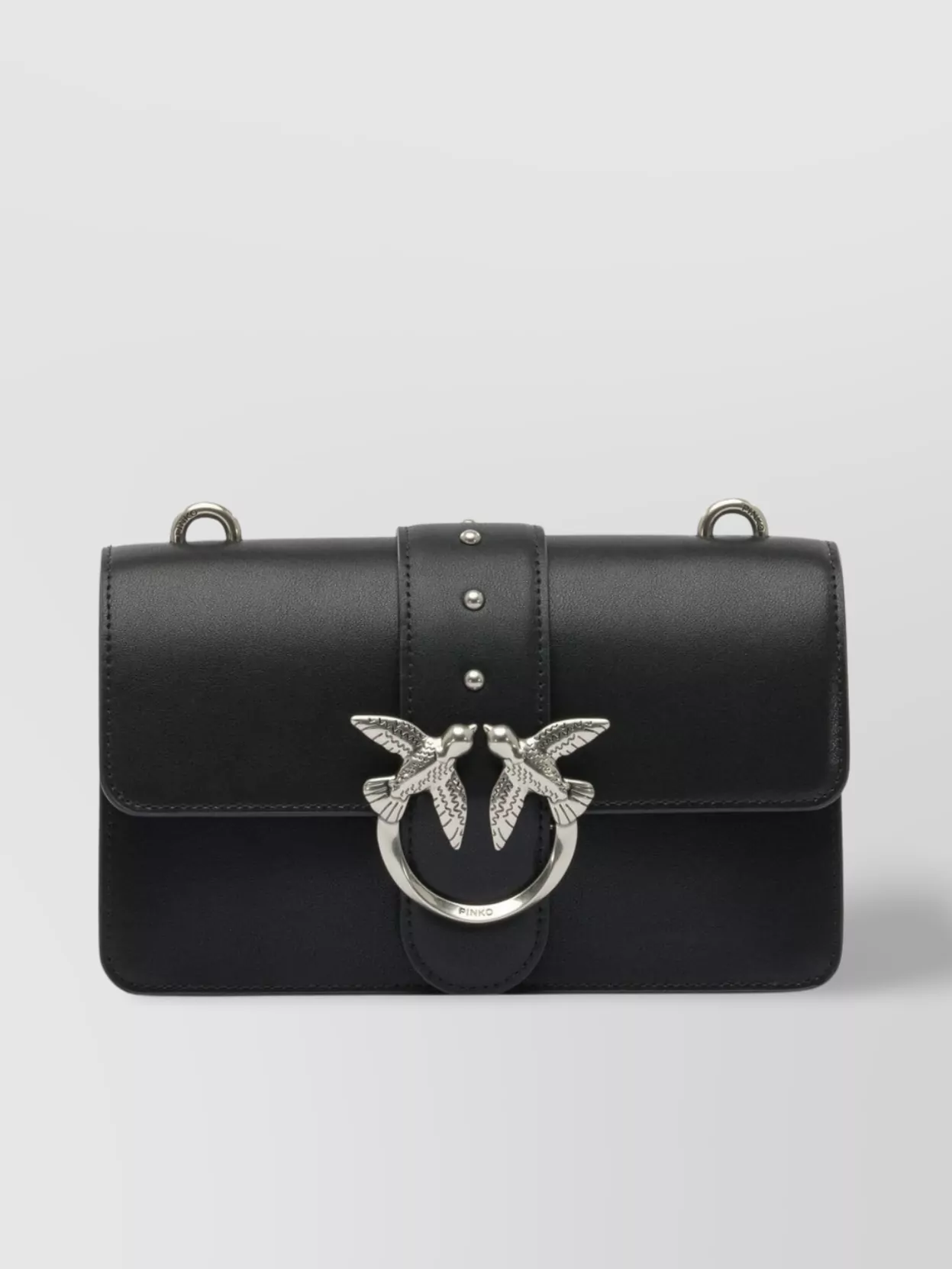 Pinko love bag one mini leather crossbody bag — The structured small black flap with silver hardware feels clean and modern, sits well with the monochrome knit and grey base, and matches the slightly elevated sneaker energy.