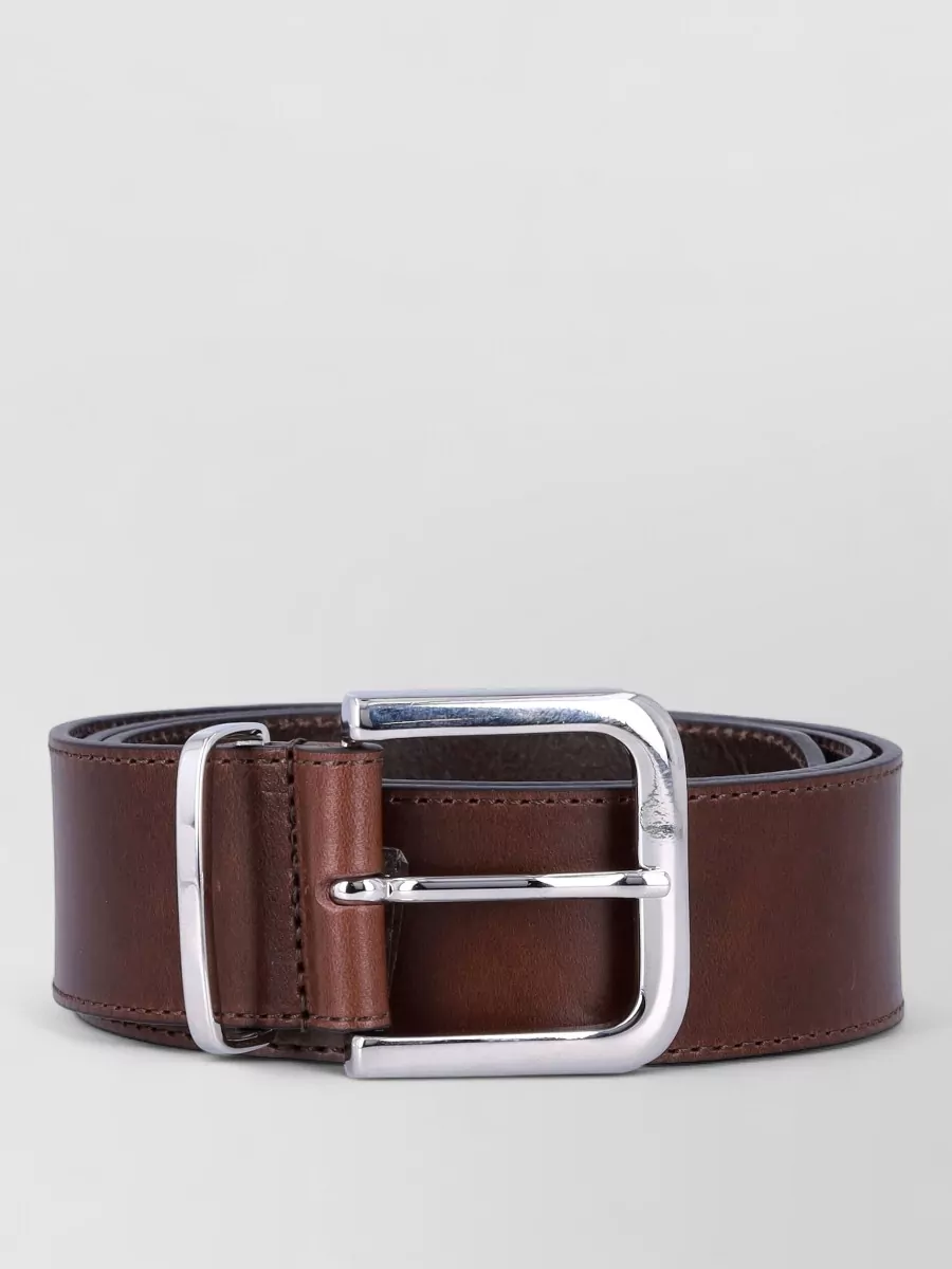 The Frankie Shop Leather belt — The Frankie Shop dark chocolate croc-embossed belt can sit over the jumpsuit’s elasticated waist to define the midsection subtly, reinforcing the elongated, body-skimming silhouette.