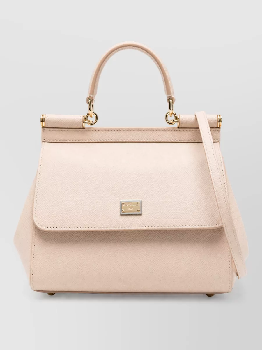 Dolce&Gabbana sicily medium leather shoulder bag — The small blush top-handle bag quietly mirrors the pumps and lets the statement shirt and trouser lead, keeping the finish romantic, polished, and in the same high-end Dolce&Gabbana universe.