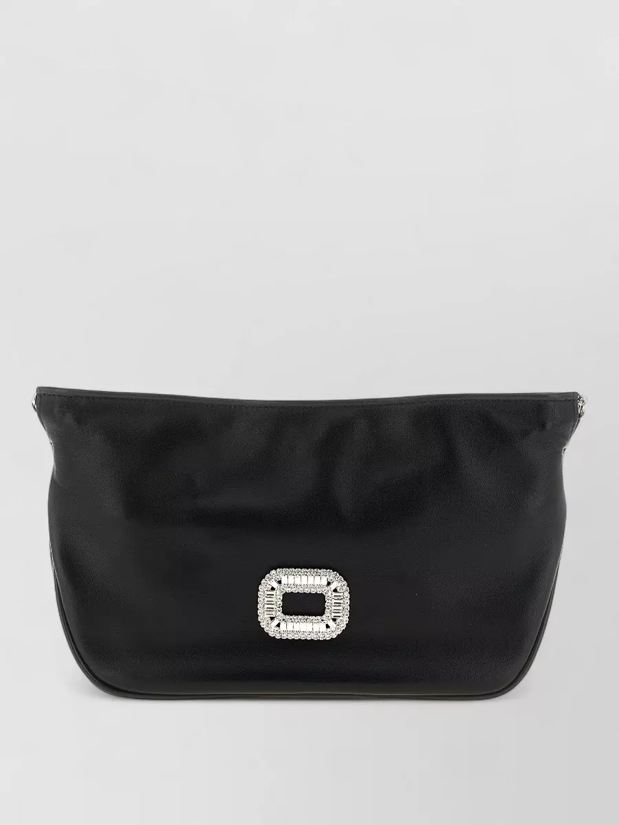 Roger Vivier Leather crystal-embellished shoulder bag — The Roger Vivier pouch reinforces the evening story with a soft black body and crystal buckle that subtly tie into the delicate lace and gold on the shoes without competing with the velvet dress.