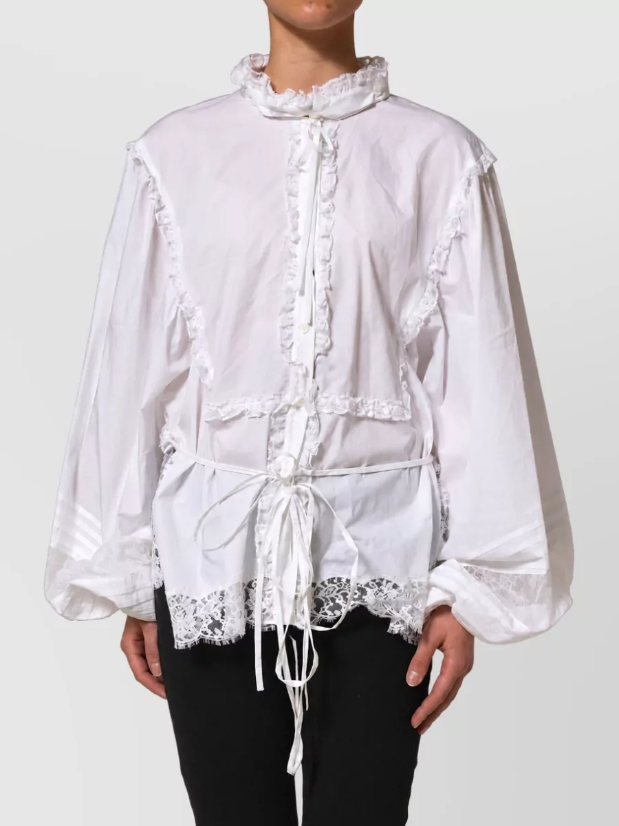 Dolce&Gabbana Ruffled lace blouse — The sculpted ivory peplum blouse mirrors the trousers’ romantic tailoring, its nipped waist and volume at the shoulder balancing the high-rise wide leg while keeping the palette clean and couture for formal summer occasions.