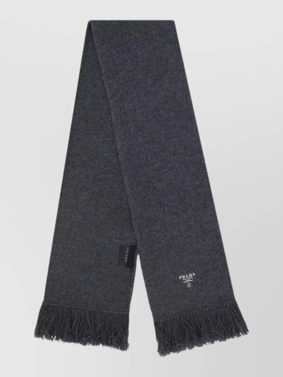Prada Cashmere scarf — The Prada charcoal scarf deepens the grey story, keeps to the refined mood, and adds subtle texture without introducing competing colour or logo noise.