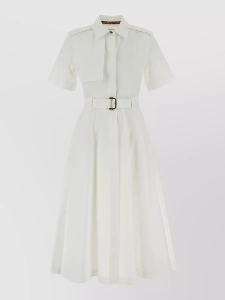 Burberry Cotton shirt midi dress — The soft ivory belted midi shirt dress gives a clean column under the black trench, aligning with its tailored quiet-luxury mood without competing Burberry check-on-check.