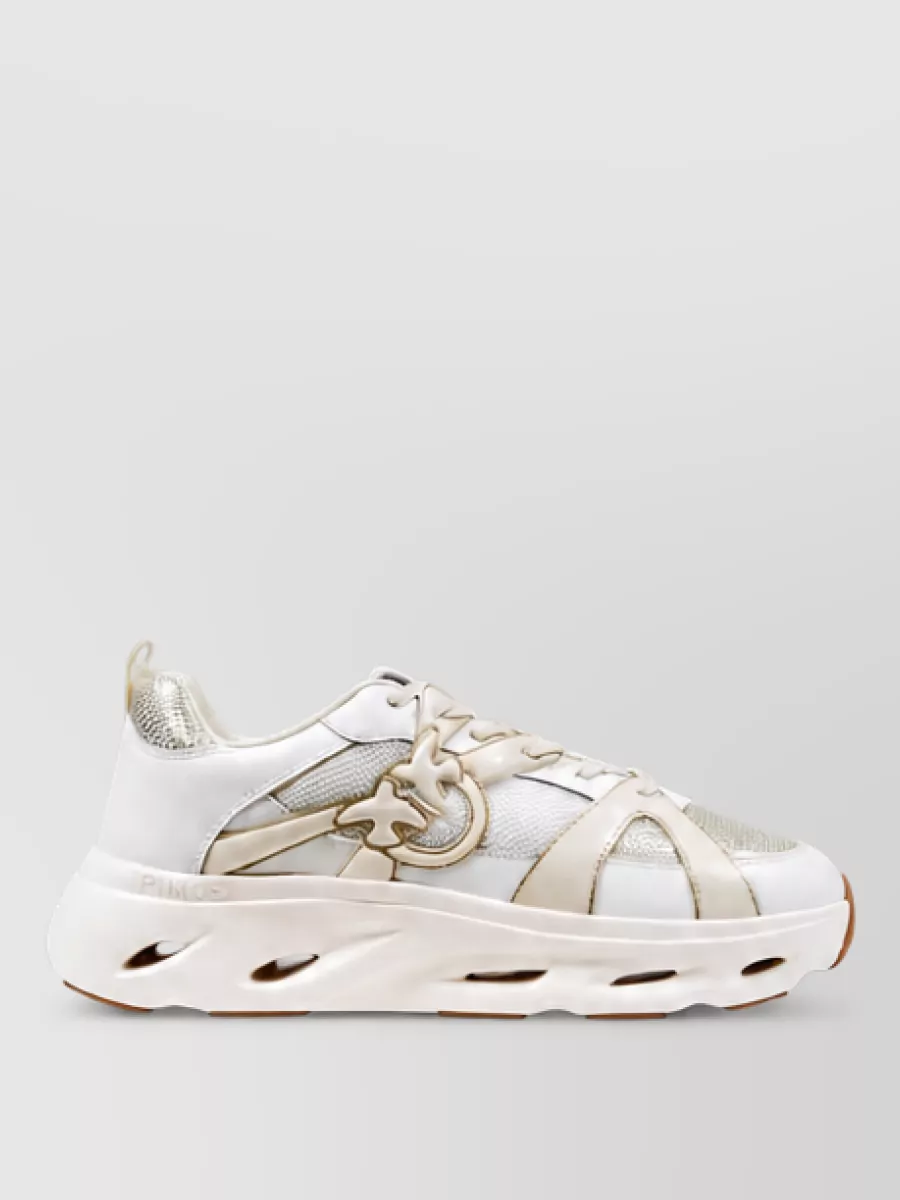 Pinko Leather low-top sneakers — The off white and champagne chunky sneakers keep the palette light, stay minimal and sporty, and add just enough height and structure to balance the soft wide-leg knits.