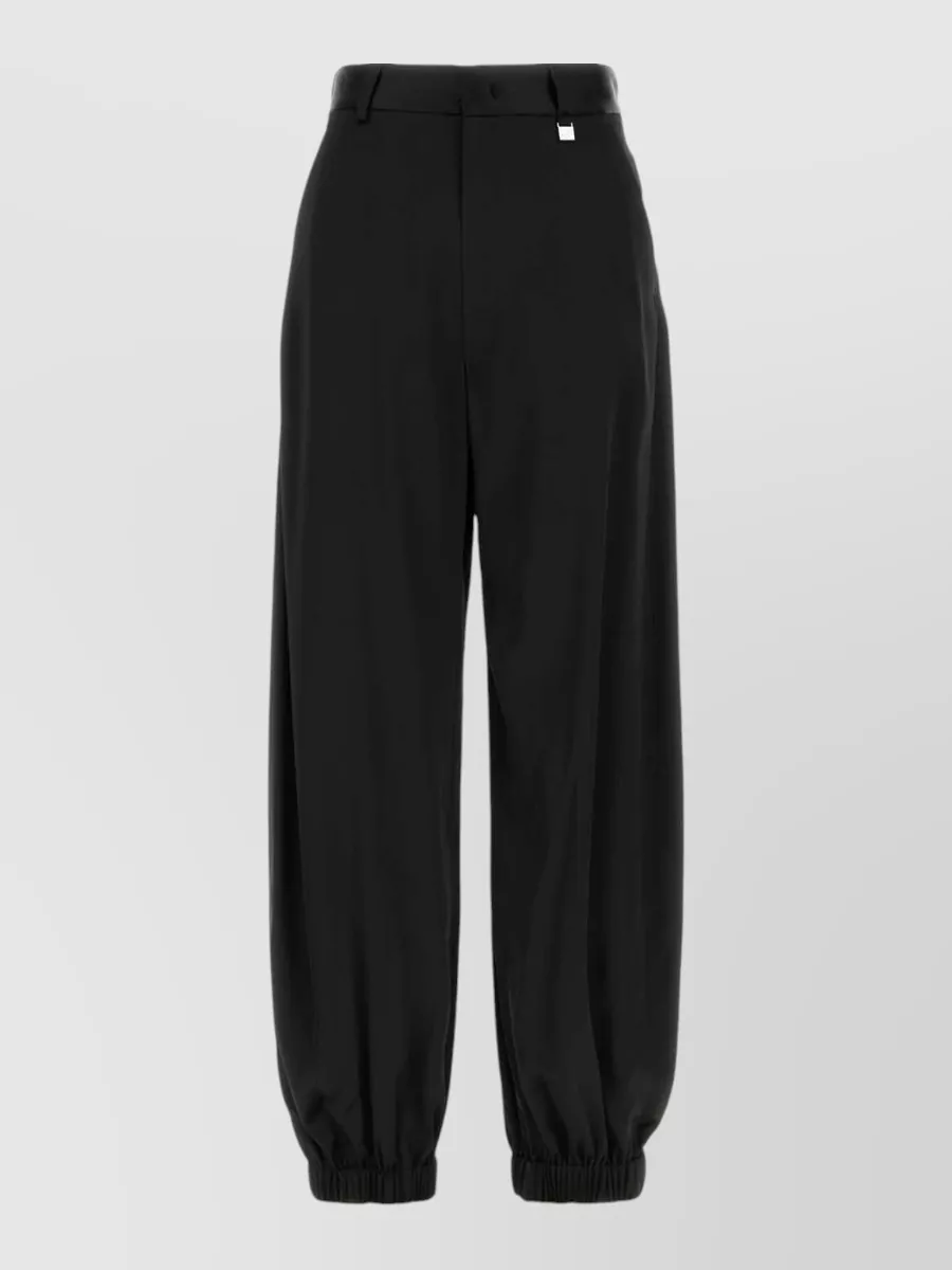 Giuseppe Di Morabito Stretch satin pants — The matching Giuseppe Di Morabito jogger-style pant mirrors the sweatshirt’s charcoal depth, elasticated hem and refined loungewear mood, creating a coordinated, quietly luxurious set that can read both at-home and city ready.