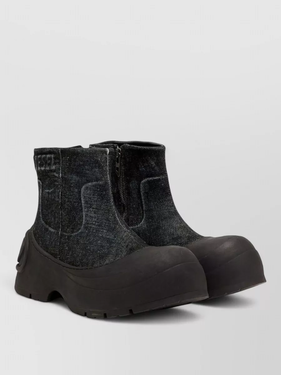 Diesel Ankle boots — Diesel’s chunky black denim boots reinforce the utility-street mood, tie into the charcoal cargo and hoodie, and add a strong, directional base under the slightly cropped outerwear.