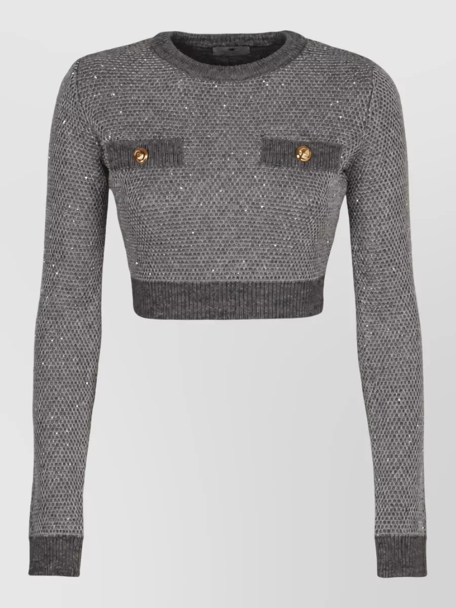 Elisabetta Franchi Sequined sweater — The cropped grey sparkle knit mirrors the skirt’s texture and tone for a cohesive preppy Y2K party set while its long sleeves balance the mini silhouette.
