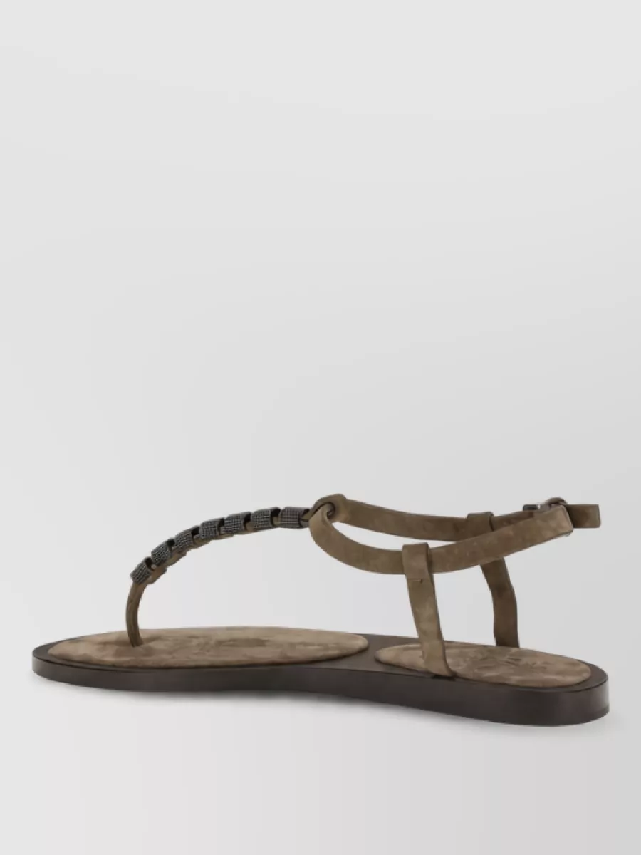 Brunello Cucinelli Leather flat sandals — The pointed mesh mule in charcoal and taupe keeps the outfit refined and airy for warm weather, echoing the vest’s texture while maintaining a polished, low-profile silhouette.