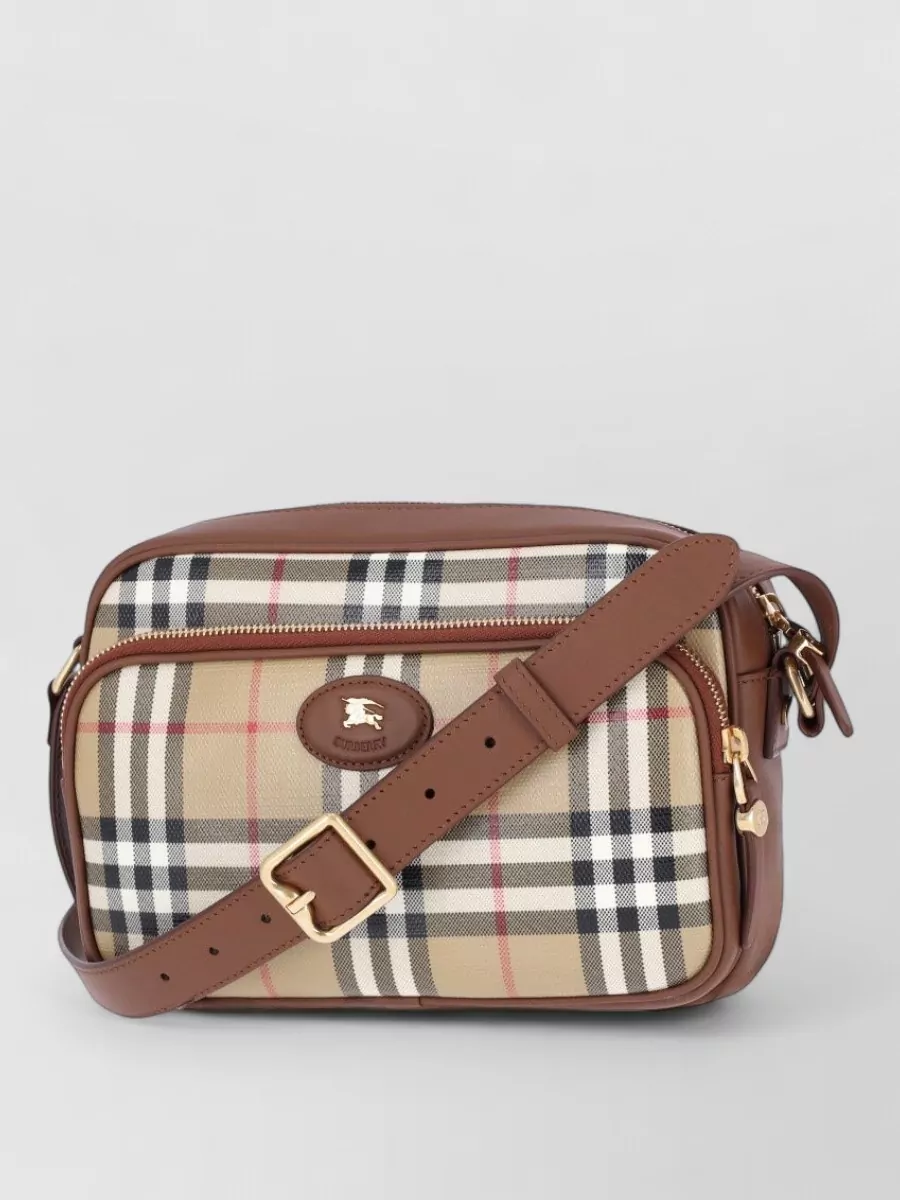 Burberry Checked cotton crossbody bag — The compact check crossbody in beige and tan mirrors the trouser and collar tones, adding a single focused heritage accent that still reads discreet and quietly luxurious.