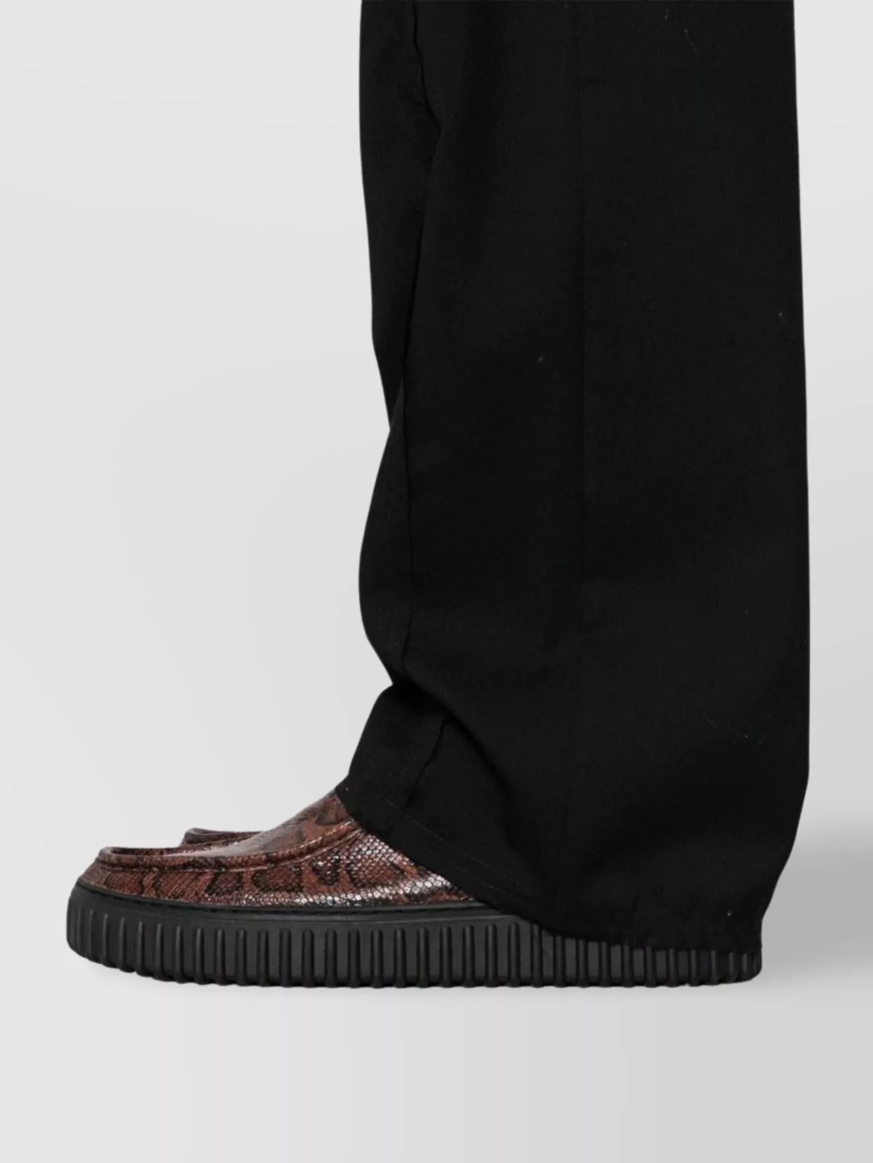 Airei Wool Trousers Featuring Exposed-seam Detailing In Black