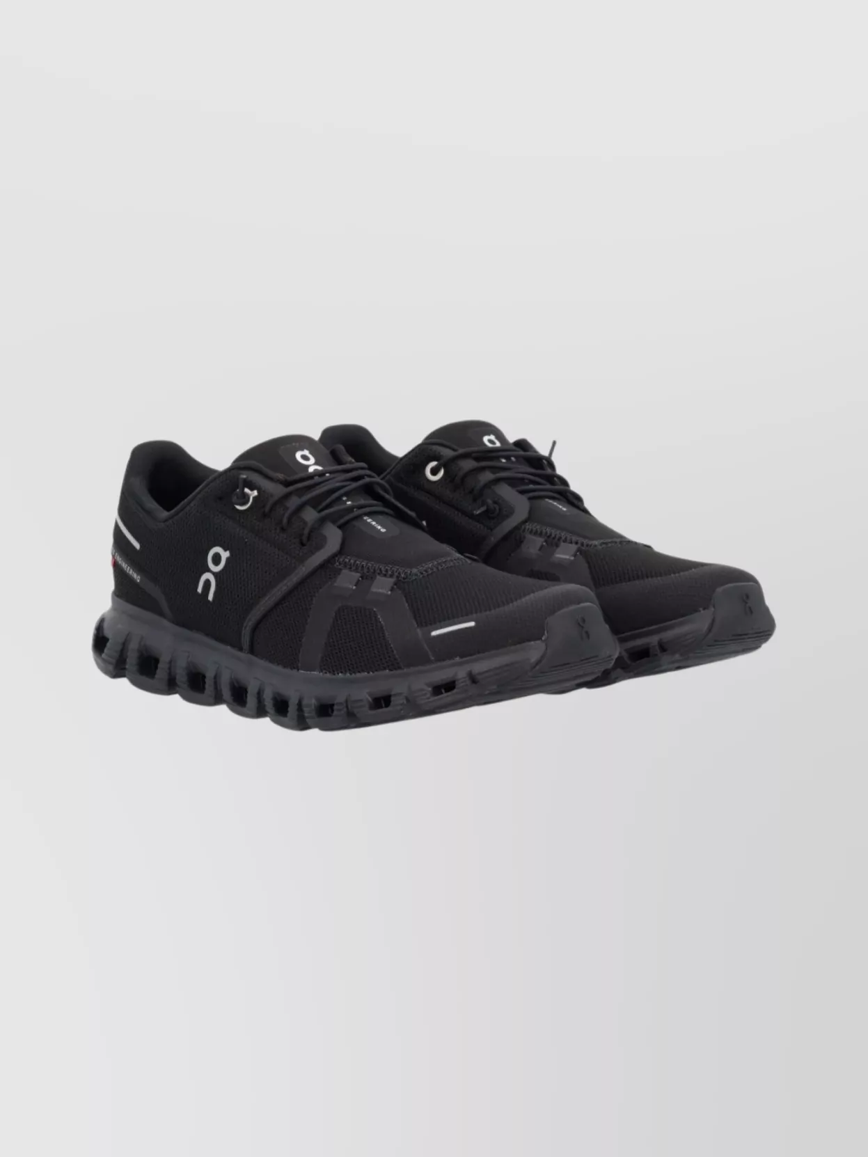 On Lightweight Mesh Sneakers Featuring Reflective Accents