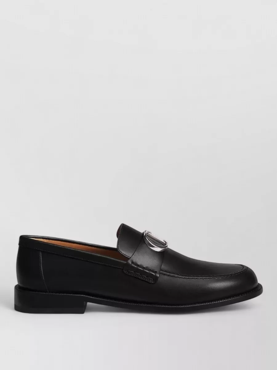 Christian Dior Loafers — The polished black derby from Dolce&Gabbana gives the cleanest formal finish to navy and charcoal tailoring, aligning with the coat’s brief of sleek black leather lace-ups.