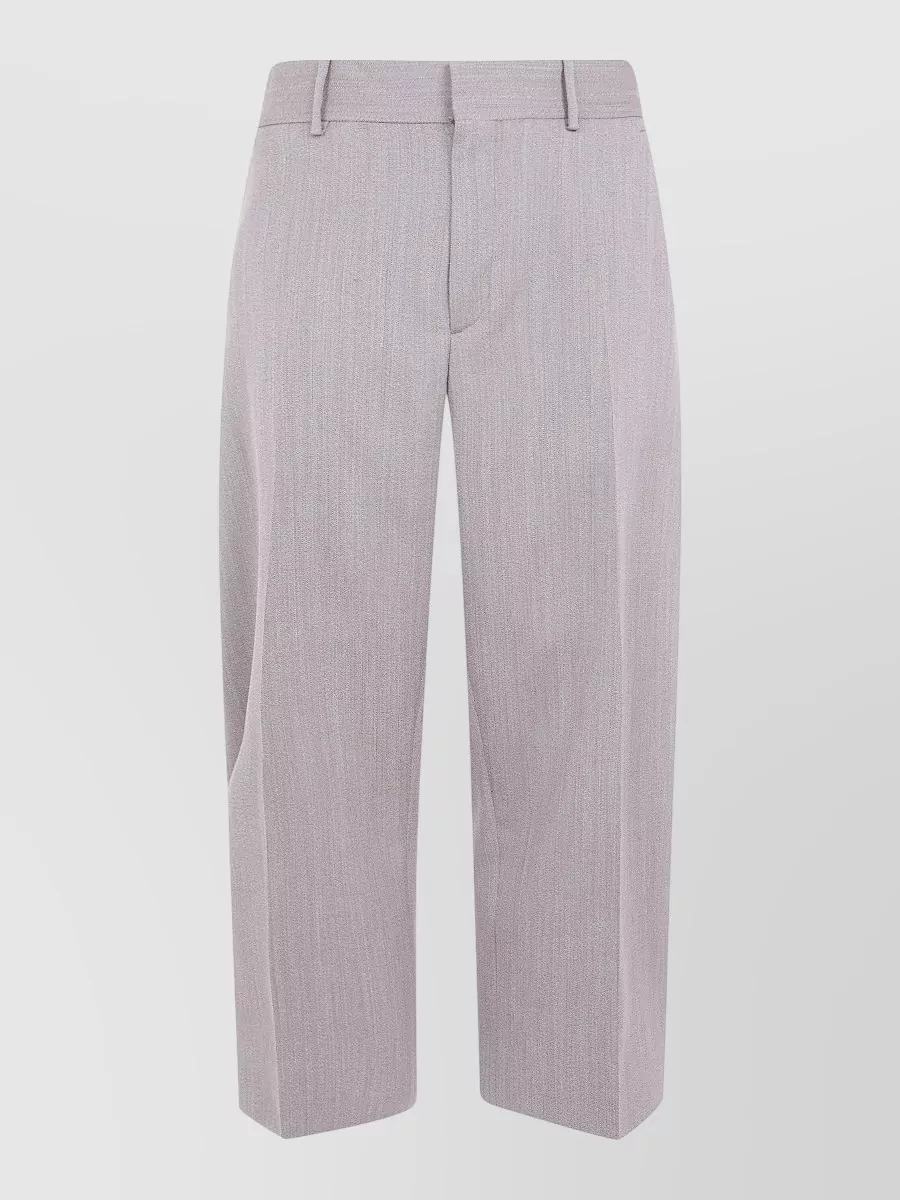 Studio Nicholson virgin wool full length curved leg tailored trousers