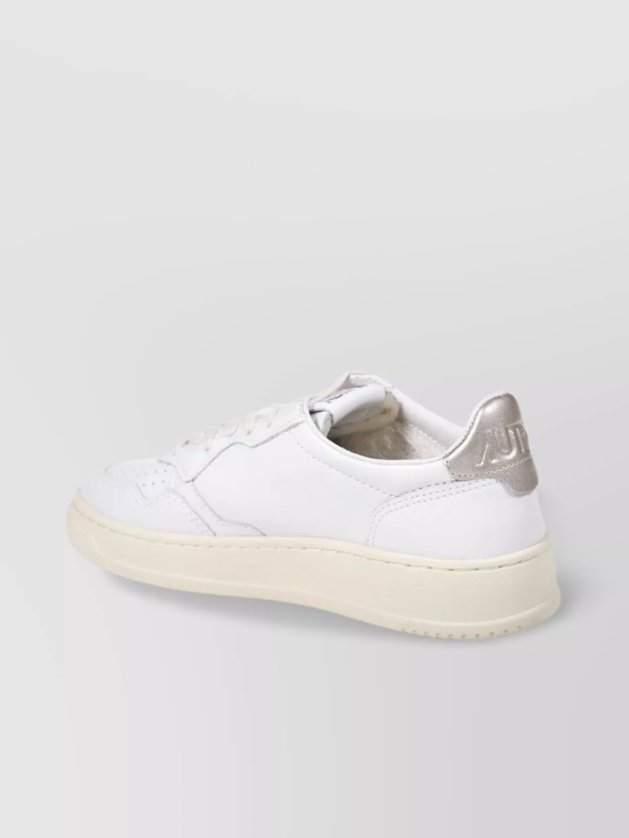 Autry Low Top Rubber Sole Sneaker With Perforated Detailing In White