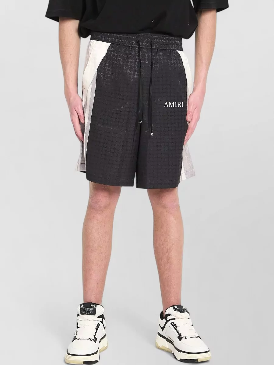 Amiri logo print viscose mid-rise wide-leg tailored shorts