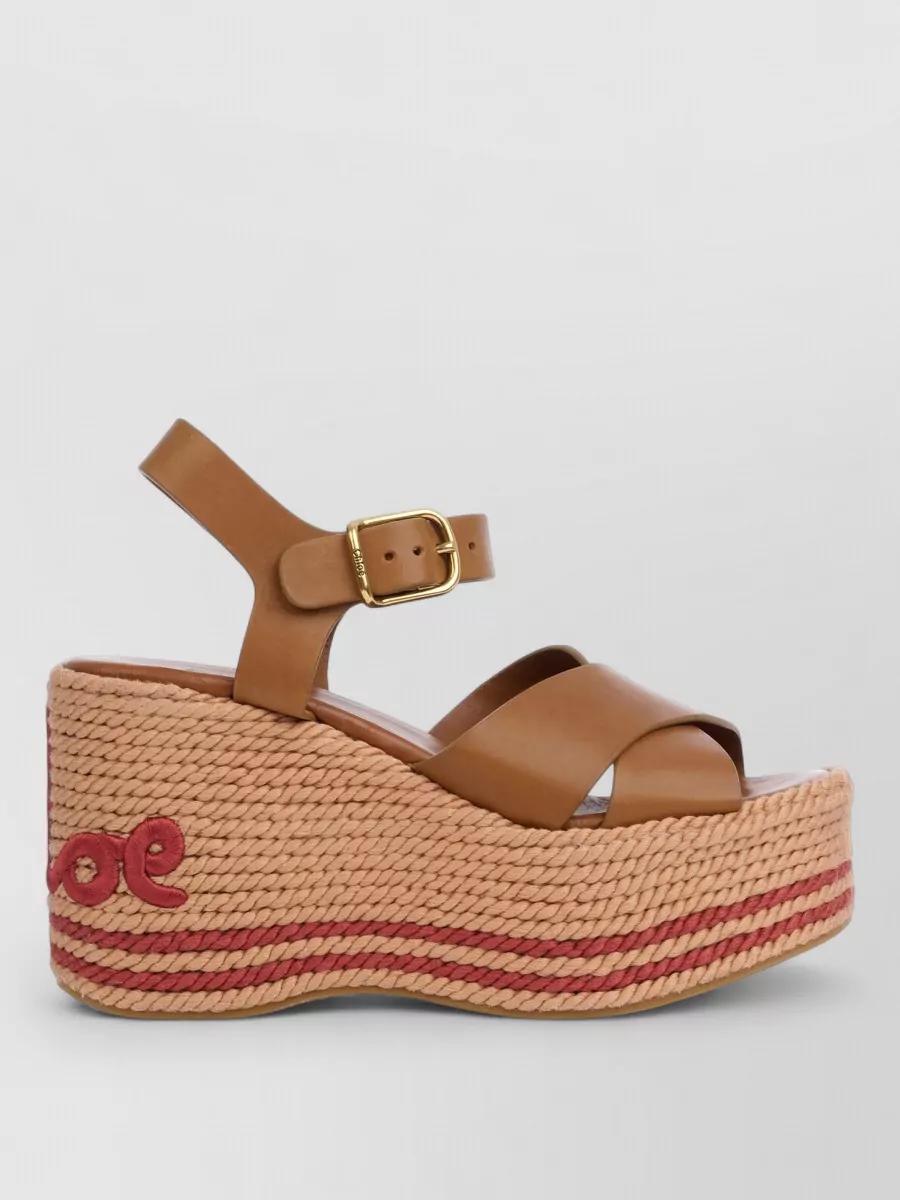 Chloé Leather wedge espadrille sandals — The cream low-heel Mary Janes are romantic, dressy enough for cocktails, and their gold studwork quietly echoes the dress’s feminine detailing while keeping the palette light and soft.