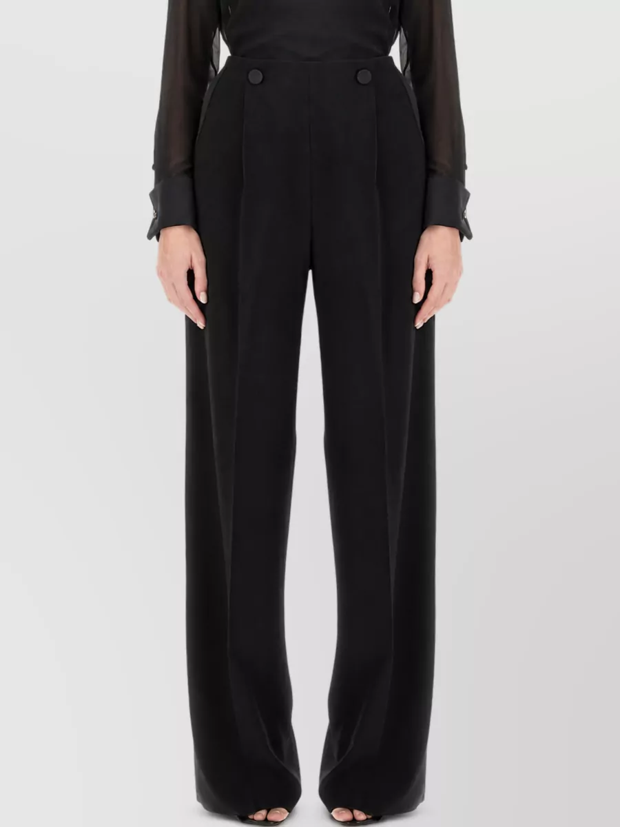 Max Mara Wide-leg trousers — The high-waisted fluid black wide-leg trouser mirrors the coat’s polished drape, elongates the line, and delivers the 'fluid wool wide-leg' pairing the peacoat prose explicitly calls out.