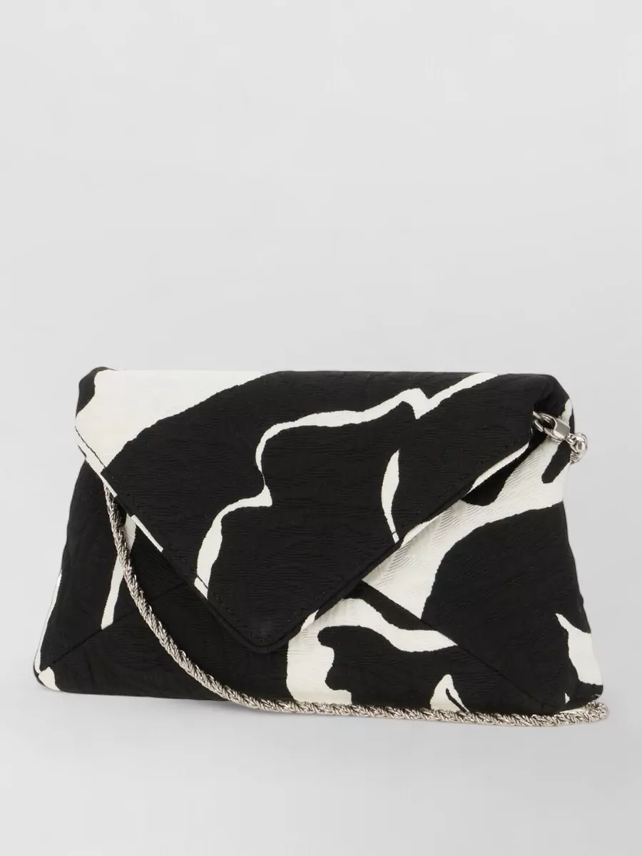 Dries Van Noten Jacquard envelope clutch bag — The black Marc Jacobs ruched clutch keeps the palette monochrome and refined while its soft structure and silver hardware echo the dress’s understated drama for evening.