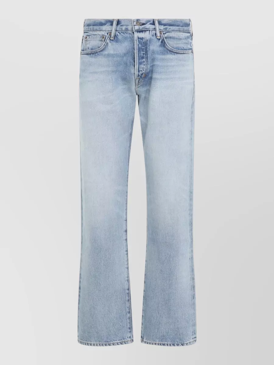 Tom Ford Denim straight-leg jeans — The Tom Ford light-wash straight leg keeps the double-denim palette soft and modern, balancing the darker Visvim shirt with a clean, regular silhouette that still reads quietly luxurious.