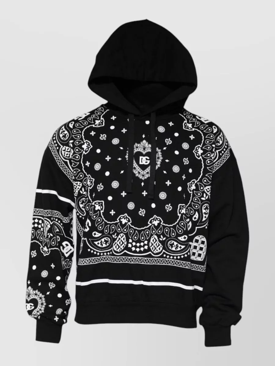Dolce&Gabbana Bandana-print hooded sweatshirt — With the already loud cartoon bomber, the matte black logo sweatshirt keeps the outfit graphic but controlled, letting the jacket’s pigs stay the main statement while maintaining a cohesive DG streetwear tier.