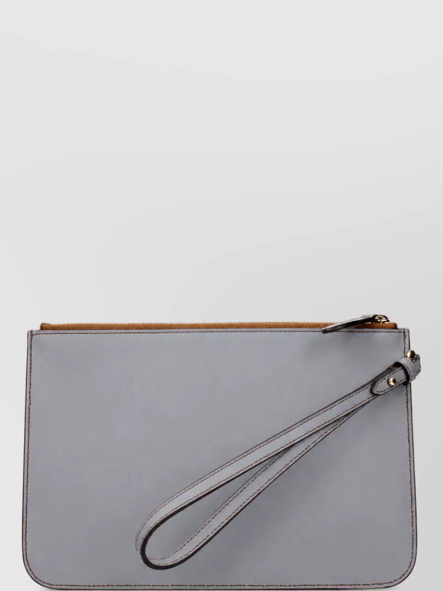 Burberry Leather clutch bag — The slim grey clutch keeps the silhouette clean and tailored, adding subtle contrast to the warm tones while remaining understated and in line with the quiet luxury brief.