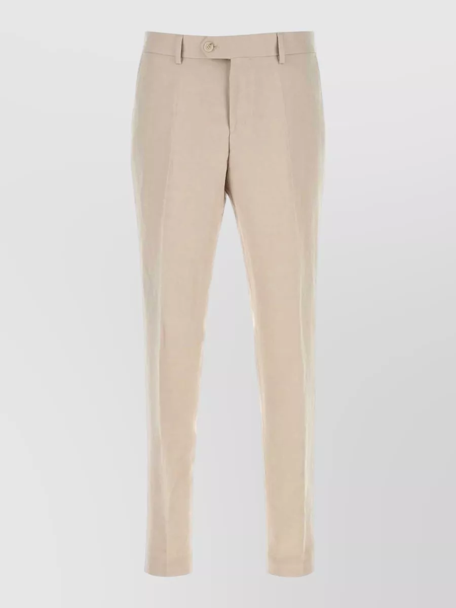 Boss Linen blend tailored trousers — The light beige tailored BOSS trouser pairs cleanly with the camel shirt and black belt, creating a modern neutral column that suits warm weather and quiet luxury.