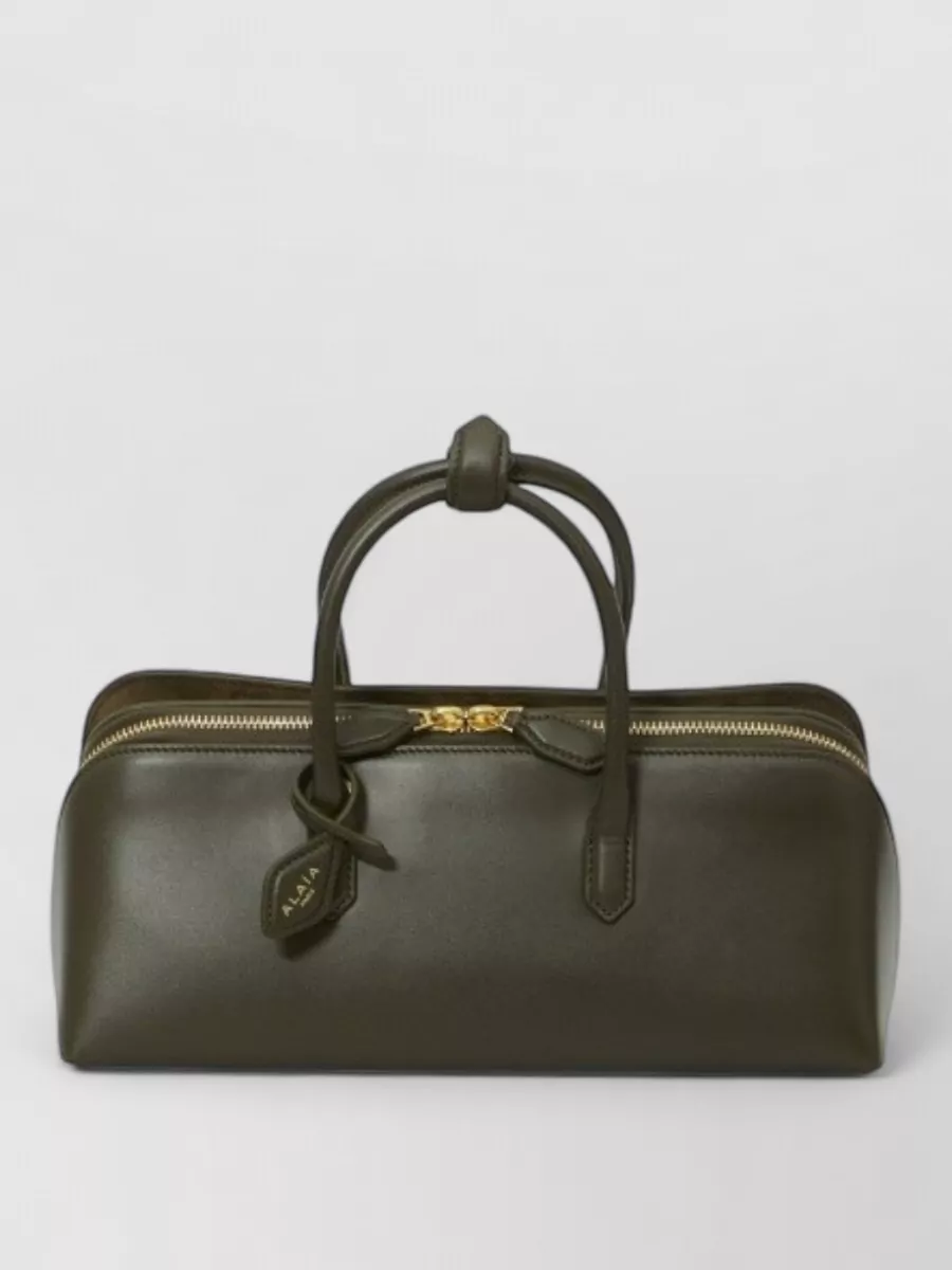 Alaïa leather camouflage top handle bag