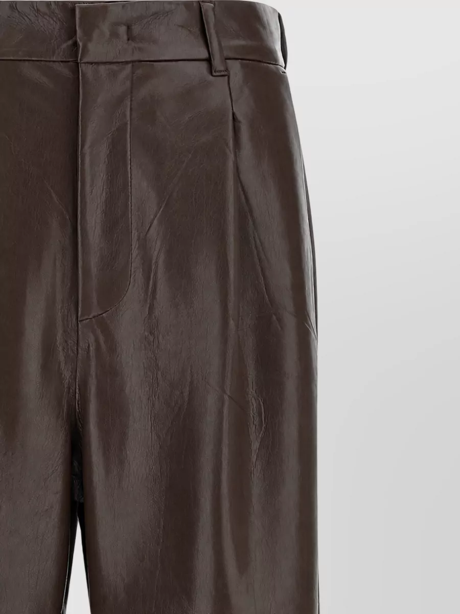 The Andamane Leather-effect pleated flared trousers