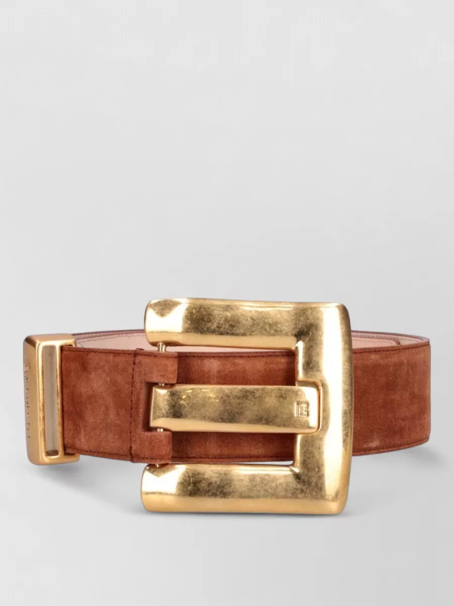 Balmain Suede anthem belt — The wide cognac suede belt A adds a sculpted, editorial waist emphasis and antique-gold hardware that harmonises with Balmain’s buttons while introducing a subtle, luxe contrast to the monochrome check.