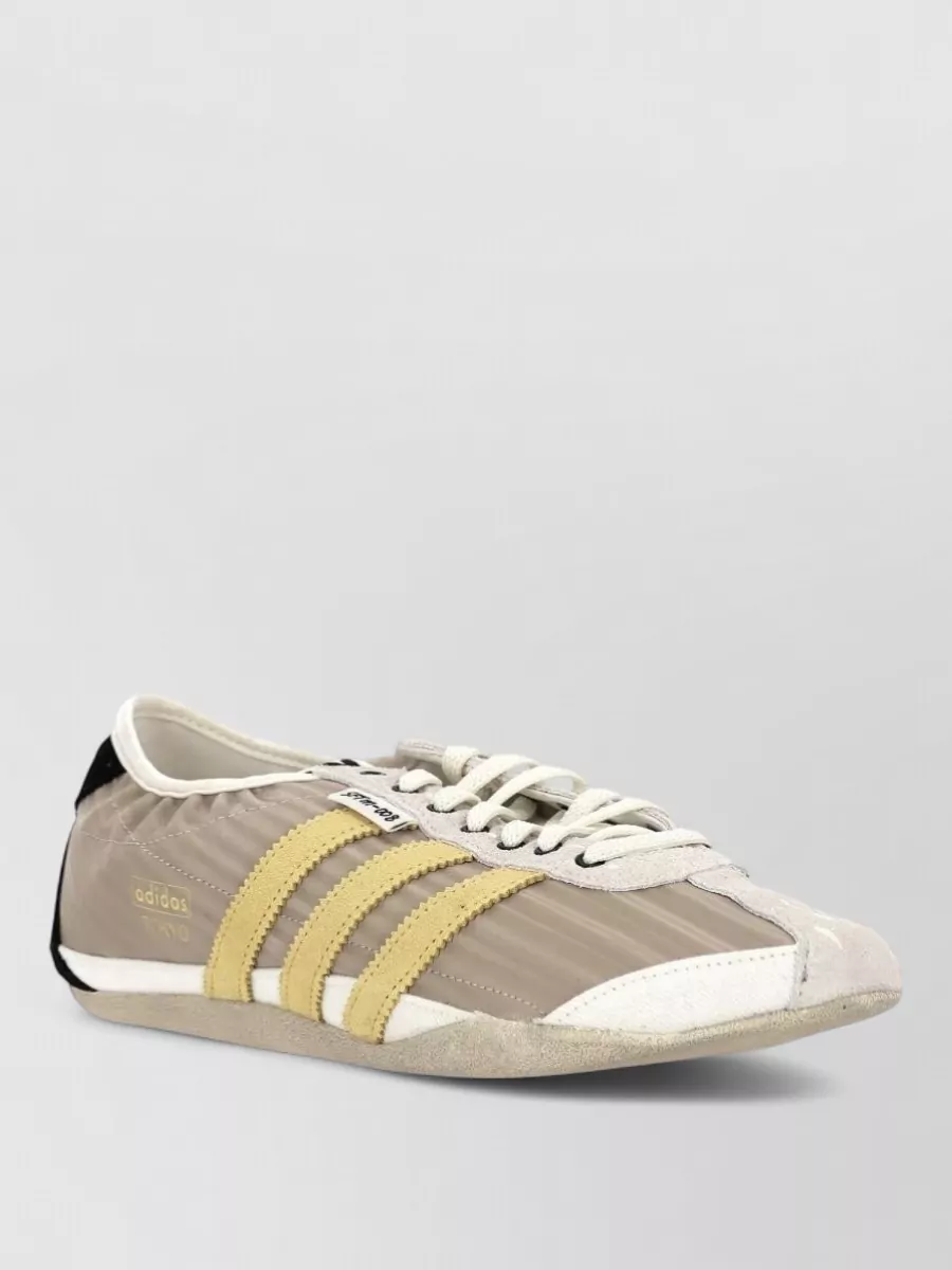 Adidas leather paneled low-top sneakers