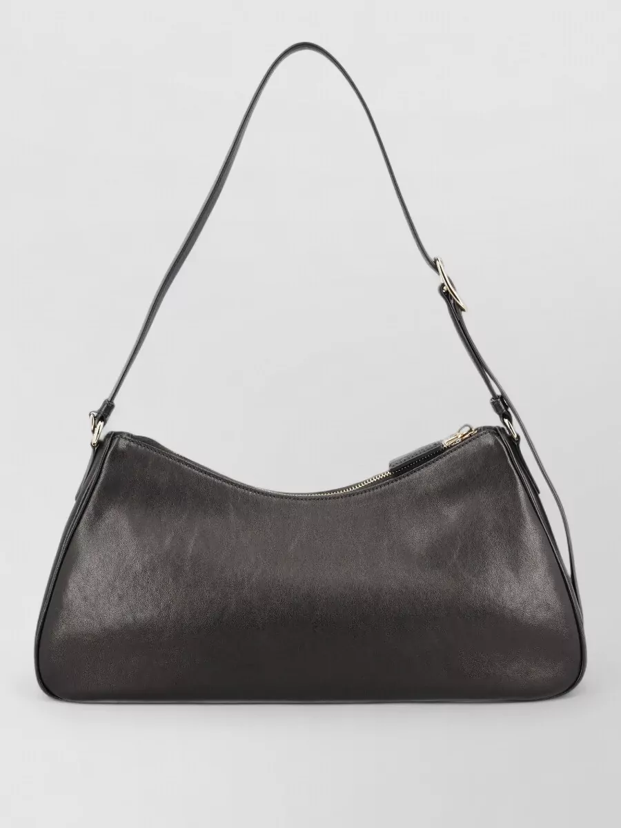 Prada Na nappa leather shoulder bag — The small structured black baguette echoes the shoes’ polished leather and minimalist hardware, giving a proportionate, precise finish that suits both desk and dinner.