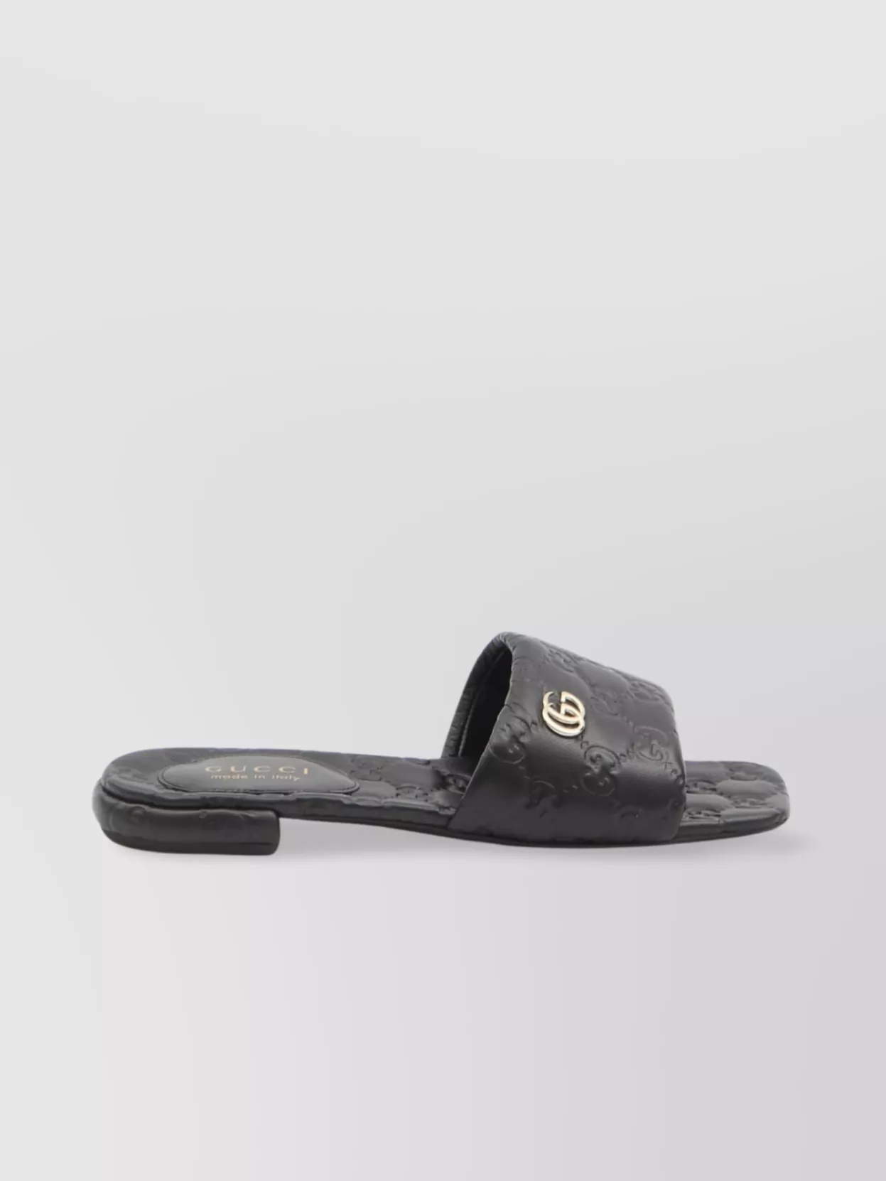Gucci Gg embossed leather slide sandals The Fashion Square