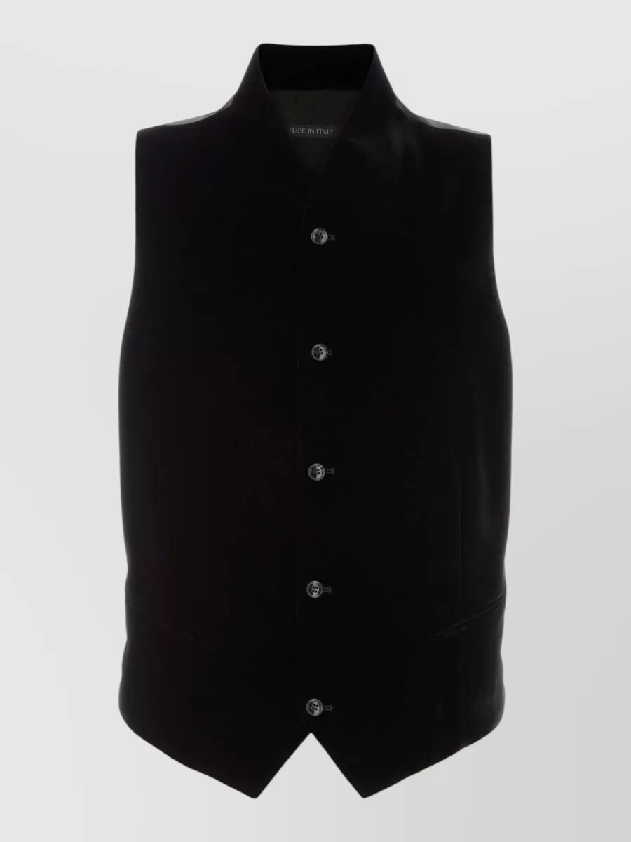 Giorgio Armani Velvet vest — The black Tagliatore full‑zip knit layers cleanly under the biker without competing lapels, keeps the mood quiet-luxury, and matches the jacket’s night-city attitude and season.