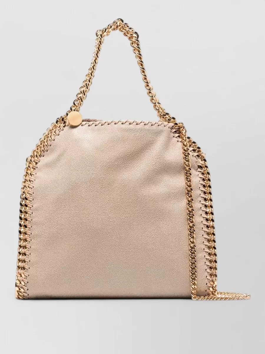 Stella Mccartney falabella mini shoulder bag — Bag I in champagne beige with gold chain feels quietly polished and harmonises with the butter yellow and cream tones while maintaining the same understated designer tier.