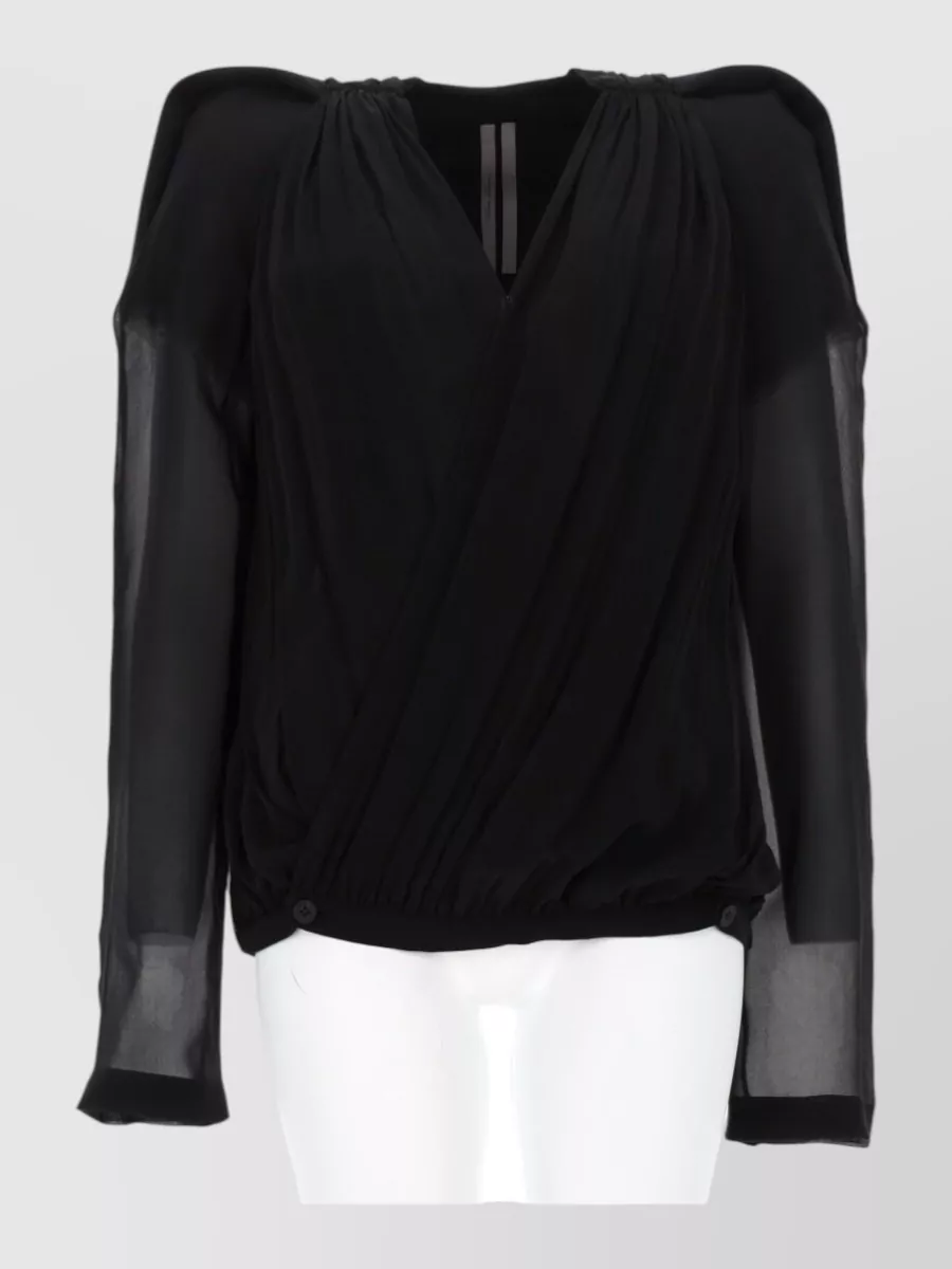 Rick Owens Silk jacket — The sheer draped wrap top mirrors the skirt’s fluid fishtail line, keeps the monochrome drama, and balances coverage and transparency for formal evening without competing with the high waist.