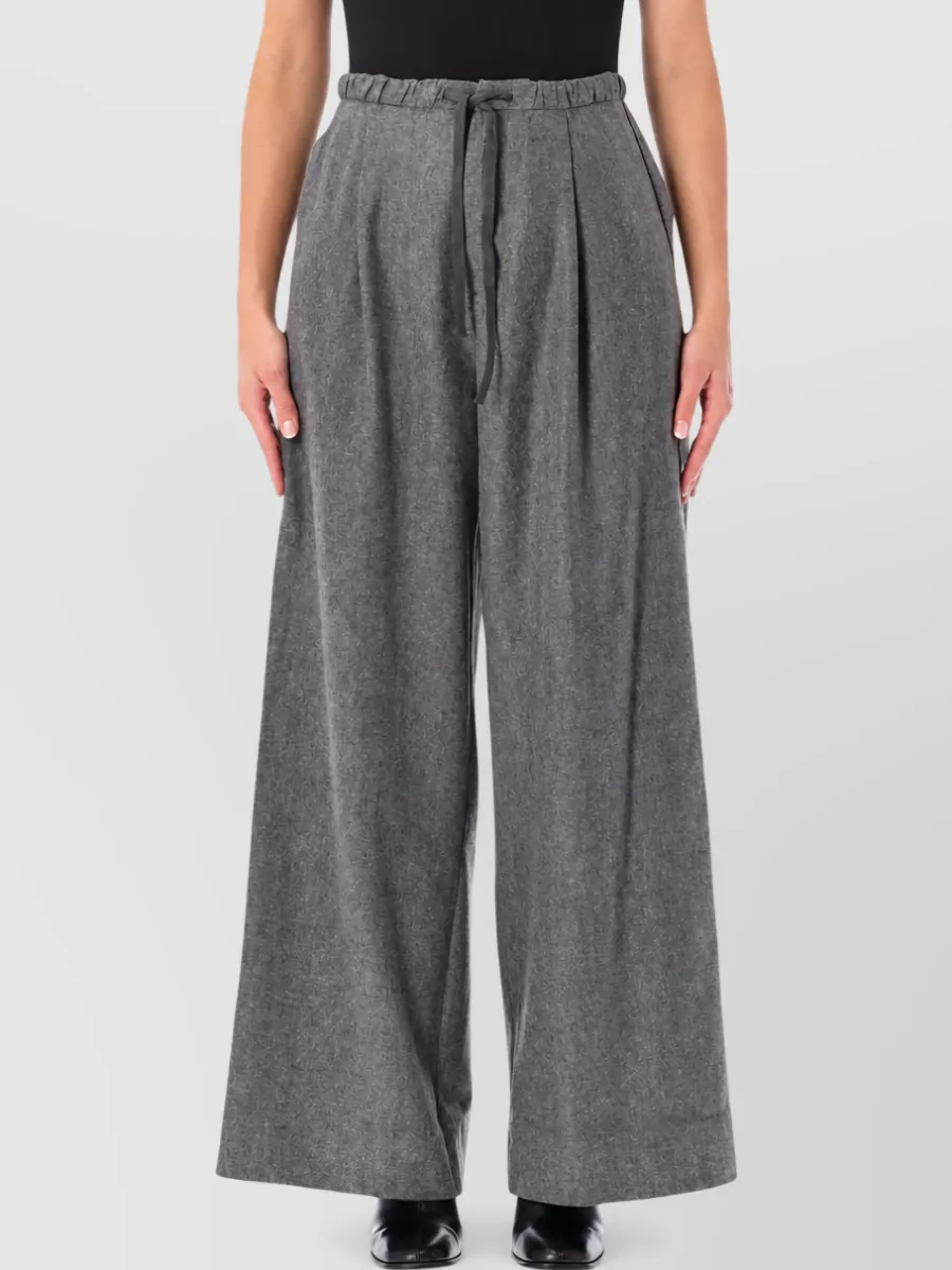 Soeur Wool wide-leg trousers — The heather grey wide-leg trouser mirrors the vest’s soft structure and palette, giving a fluid high-waist line that keeps the outfit minimalist and quietly polished for cool-season city days.
