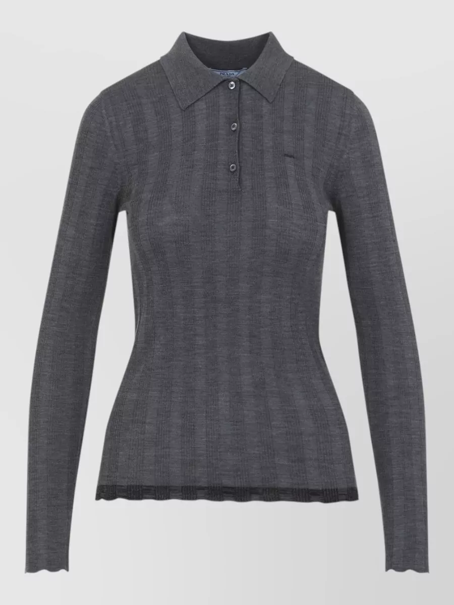 Prada Fine-knit wool polo shirt — The charcoal ribbed polo mirrors the loafer’s minimalist, collegiate mood and keeps the upper body clean and close to the body for sharp balance with tailored bottoms.
