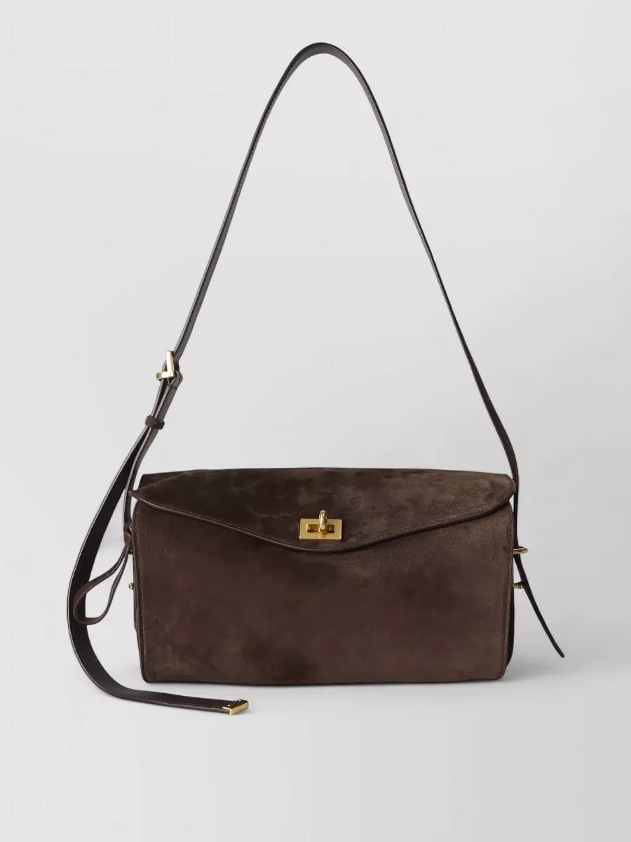 Balenciaga Medium suede shoulder bag — The Celine mahogany flap bag adds a slightly darker brown accent that grounds all the warm camel tones, staying in the same high-luxury tier and precise, tailored aesthetic.