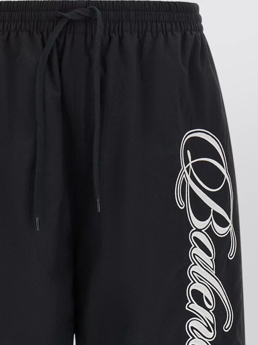 Balenciaga Reversible Trousers Featuring Cursive Motif Design