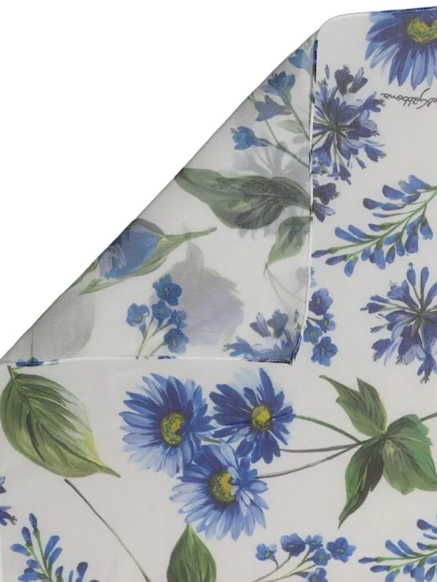 Dolce&Gabbana Floral square scarf — The airy floral scarf in ivory, cobalt and green can be tied at the neck or bag to subtly pick up the leggings’ palette without competing with the main print.