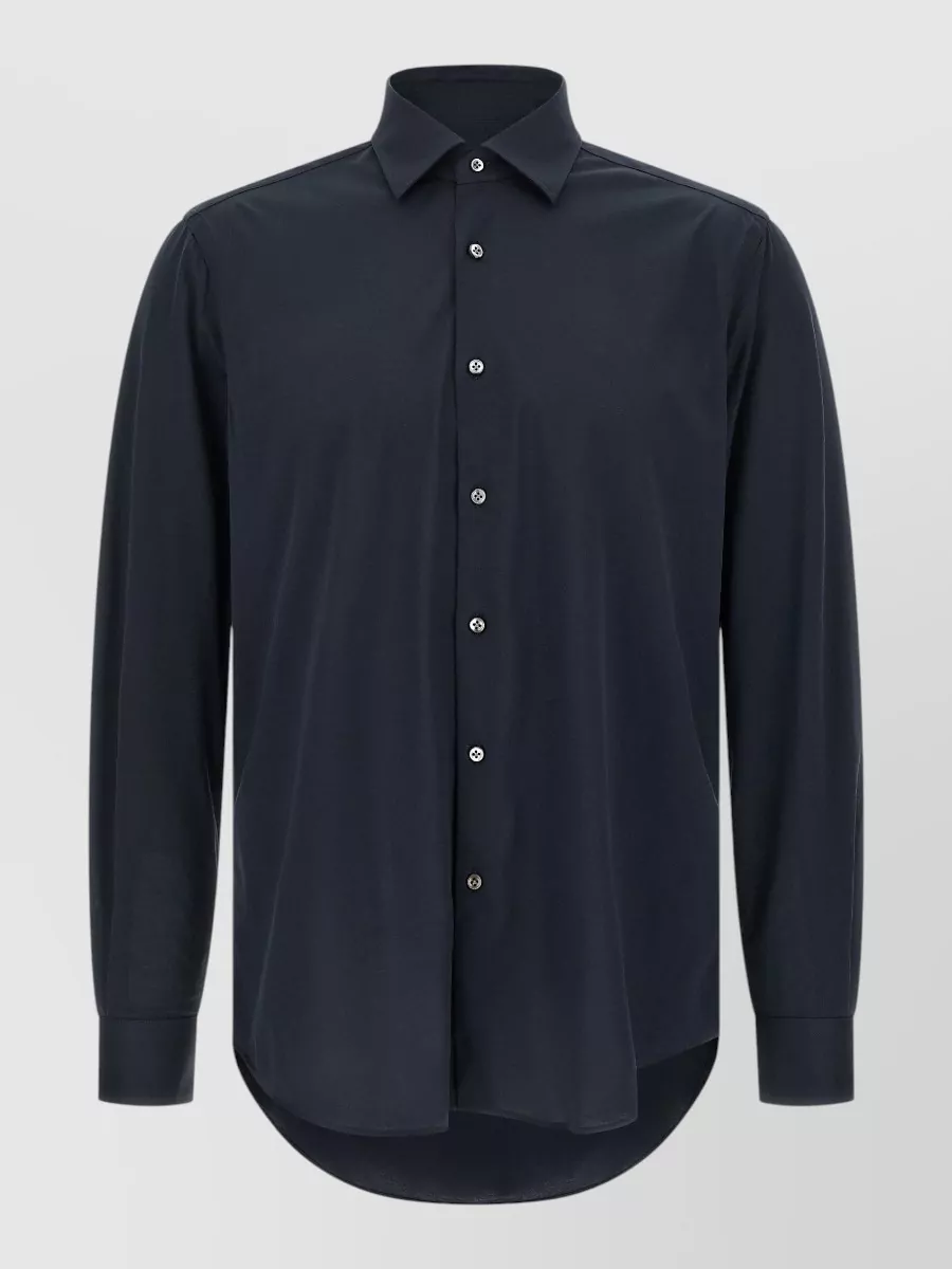 Pal Zileri Cotton long-sleeve shirt — The Pal Zileri navy shirt mirrors the short’s tailored, minimalist mood and navy palette, creating a clean, quietly luxe column of color that stays polished yet breathable for warm days.